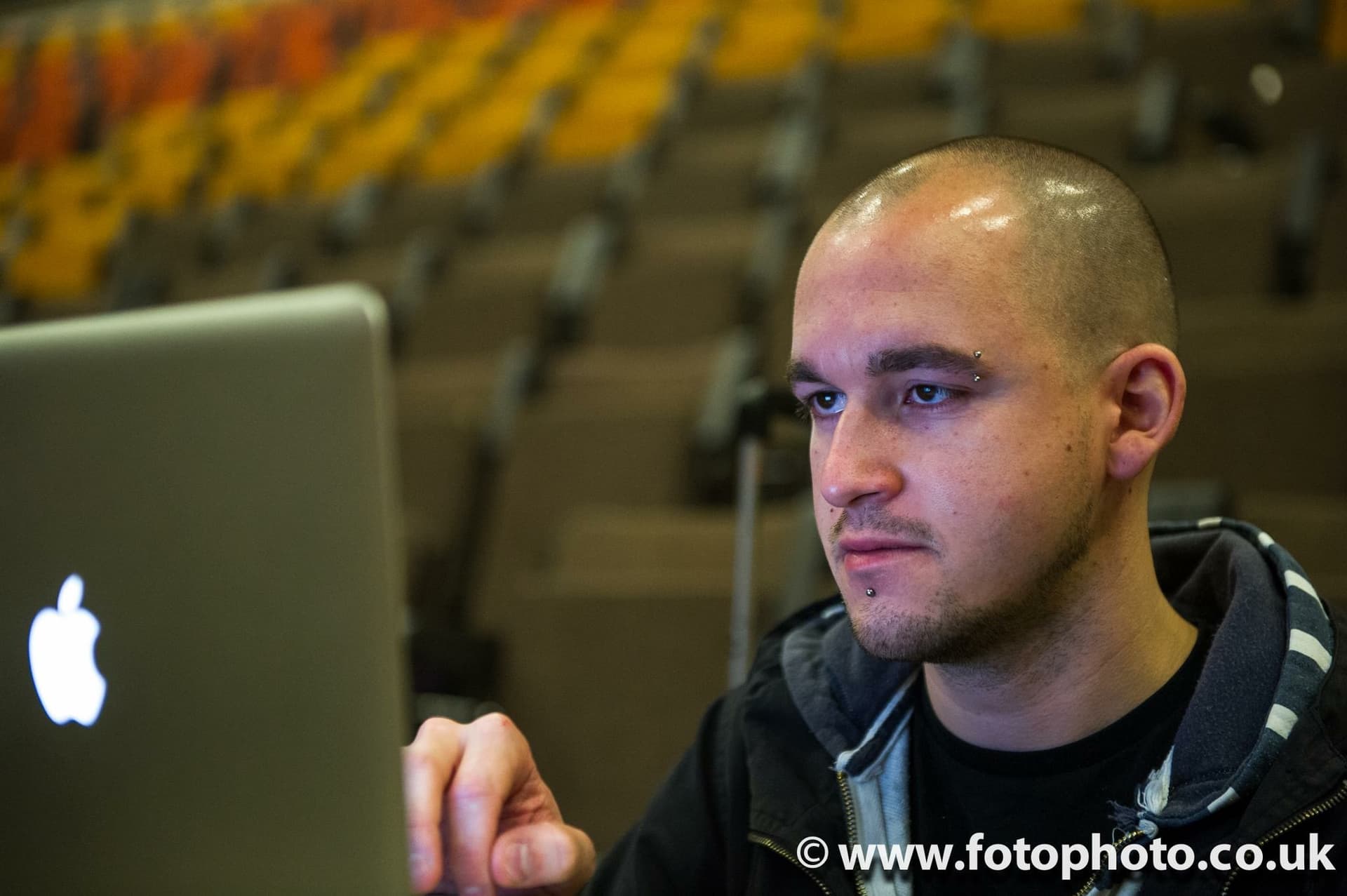 James working on a laptop