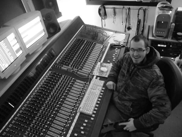 James at a mixing desk, black and white
