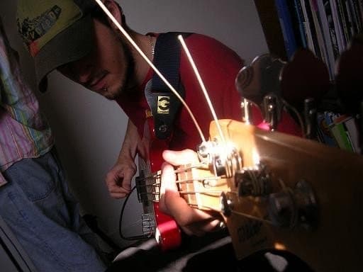 James playing bass guitar